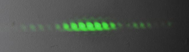 green laser pattern on black background